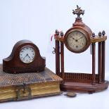 A Victorian family photograph album, a small Continental clock, and a larger Continental pillar