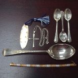 A silver cross, a silver tablespoon, a silver-gilt bracelet, teaspoons etc