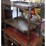An Oriental brown lacquered and chinoiserie decorated 2-tier butler's trays on folding stand