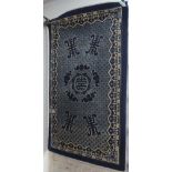 A Chinese design blue ground rug, 150cm x 90cm