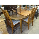 A mid-century teak extending dining table, with 2 spare leaves, L155cm extending to 265cm,