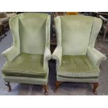 A pair of mid-century Parker Knoll upholstered wing armchairs