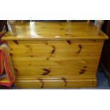 A modern polished pine toy box, W93cm