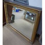 A bevelled-edge wall mirror in embossed gilt frame, length 105cm