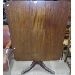 A Regency mahogany rectangular tilt-top dining table, on spiral turned column and tripod base,
