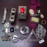 A box containing an Indian white metal bangle, a silver Masonic medallion, and other silver