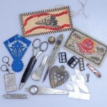 An advertising magnifier, needle cases, mother-of-pearl gaming tokens etc