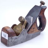 An Antique Norris carpenter's woodworking plane, with brass mounts, length 23"