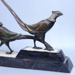 A pair of patinated bronze Egyptian revival style birds on coloured marble plinths, length 47cm