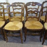14 French stained beech ladder-back and rush-seated dining chairs
