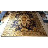 A large blue ground Persian design wool rug, 340cm x 250cm