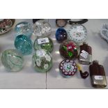 A collection of 10 glass paperweights