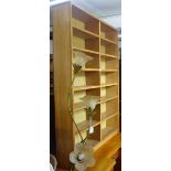 A 1920s light oak floor standing open bookcase, W107cm, H147cm