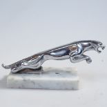 A Vintage chrome Jaguar car mascot on alabaster plinth, length 19cm