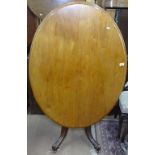 A 19th century mahogany oval loo table, raised on sabre leg base, L118cm