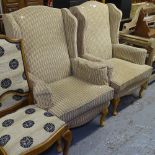 A pair of striped upholstered wing-back armchairs, on cabriole legs