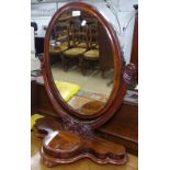A Victorian mahogany swing toilet mirror, on serpentine-front stand, W68cm, H82cm