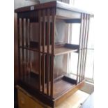An Antique rosewood revolving bookcase, W48cm