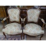 A pair of French carved beech-framed open armchairs