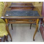 An Edwardian lady's writing desk, with raised super stretcher, single frieze drawer, on acanthus