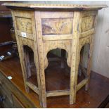 An Indian hardwood folding octagonal occasional table, with brass inlaid decoration, H53cm
