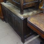 An Antique oak cabinet, with linenfold panelled doors, on stile legs, L127cm, H73cm