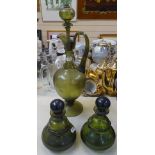 An Antique green glass claret jug and stopper, 41cm, and a pair of green decanters and stoppers