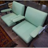 A pair of mid-century Italian lounge chairs, with steel frame and stretchers