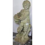 A weathered concrete garden figure, boy holding a basket, H75cm