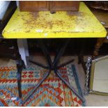A painted yellow metal-top pub table, W60cm, H75cm