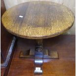 A small oak circular occasional table, by Titchmarsh & Goodwin, with label to the underside