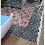A large pink ground Turkish design carpet, 285cm x 247cm
