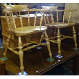 A pair of pine bow-arm Captain's chairs