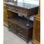 A 1930s Jacobean style oak buffet, with fitted drawers and cupboards, W107cm, H107cm