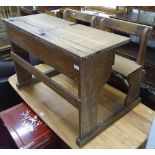 A Vintage oak child's double school desk, W102cm