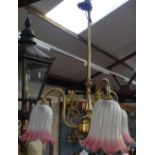 A brass 3-branch ceiling light with glass shades, 48cm across