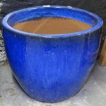 A blue glazed terracotta garden plant pot, H40cm