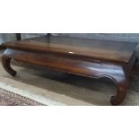 A Chinese style hardwood rectangular coffee table, on scrolled feet, L125cm, D75cm