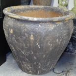 A large textured terracotta garden plant pot, H61cm