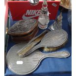 A silver-backed dressing table brush and mirror, silver-mounted scent bottles, a silver-mounted
