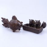 An Oriental bronze fish, length 7cm, and a miniature bronze depicting 3 pigs at a trough