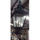 A metal-framed 4-sided lantern, height 50cm approx