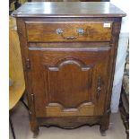 An Antique Continental oak side cabinet, with single frieze drawer and fielded panelled cupboard