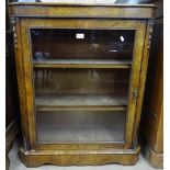 A Victorian walnut pier cabinet, with single glazed door, satinwood stringing and ormolu mounts,