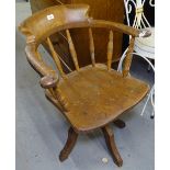 A Victorian elm-seated swivel desk chair, marked Glenisters V.R. to the underside