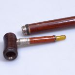 An unusual walking cane with screw-off pipe top