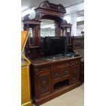 An impressive Art Nouveau walnut mirror-back sideboard, with fitted drawers and carved panelled