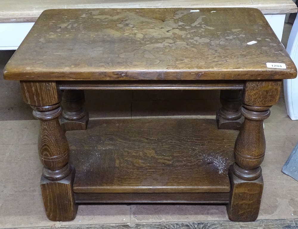 A rectangular oak 2-tier lamp table, on baluster legs, W61cm