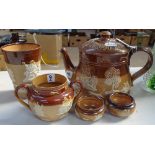 A Doulton Lambeth Harvest teapot, height 15cm, a beaker, a sugar bowl, and 2 salt pots