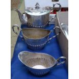 A small silver plated half-fluted 3-piece teaset